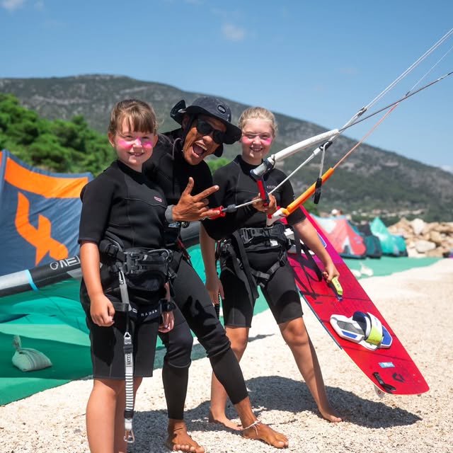 Students and instructor with kiteboarding equipment at Kite School Bol