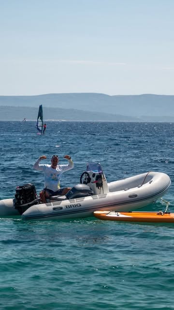 The Kite School Bol support boat on the water